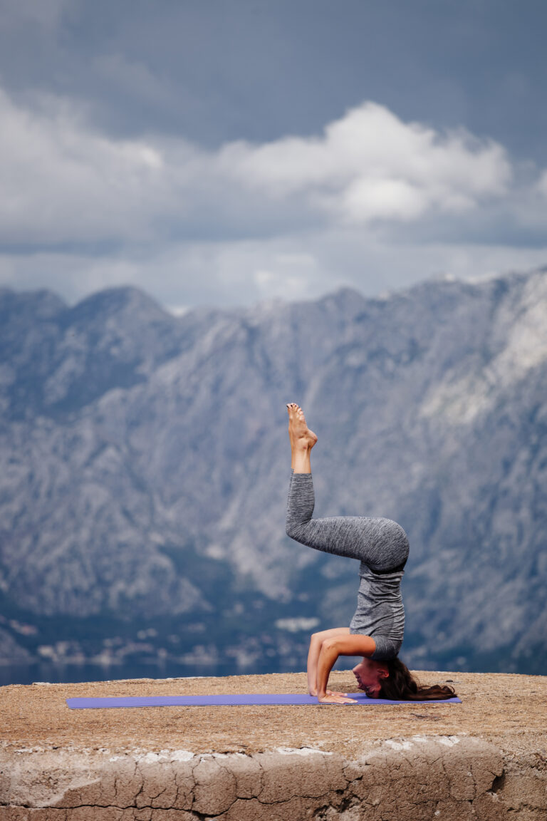 woman yoga and stretching in mountains. Montenegro, Kotor.